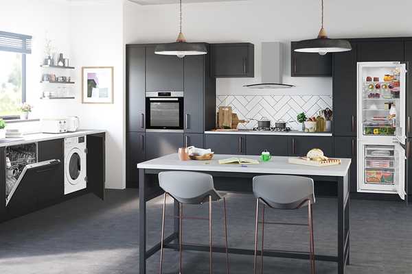 :  Image shows a sleek, monochrome  kitchen with Beko appliances including a washing machine, dishwasher and fridge freezer.